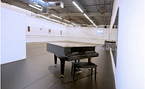 inside studio of Denver Dance Studio with piano